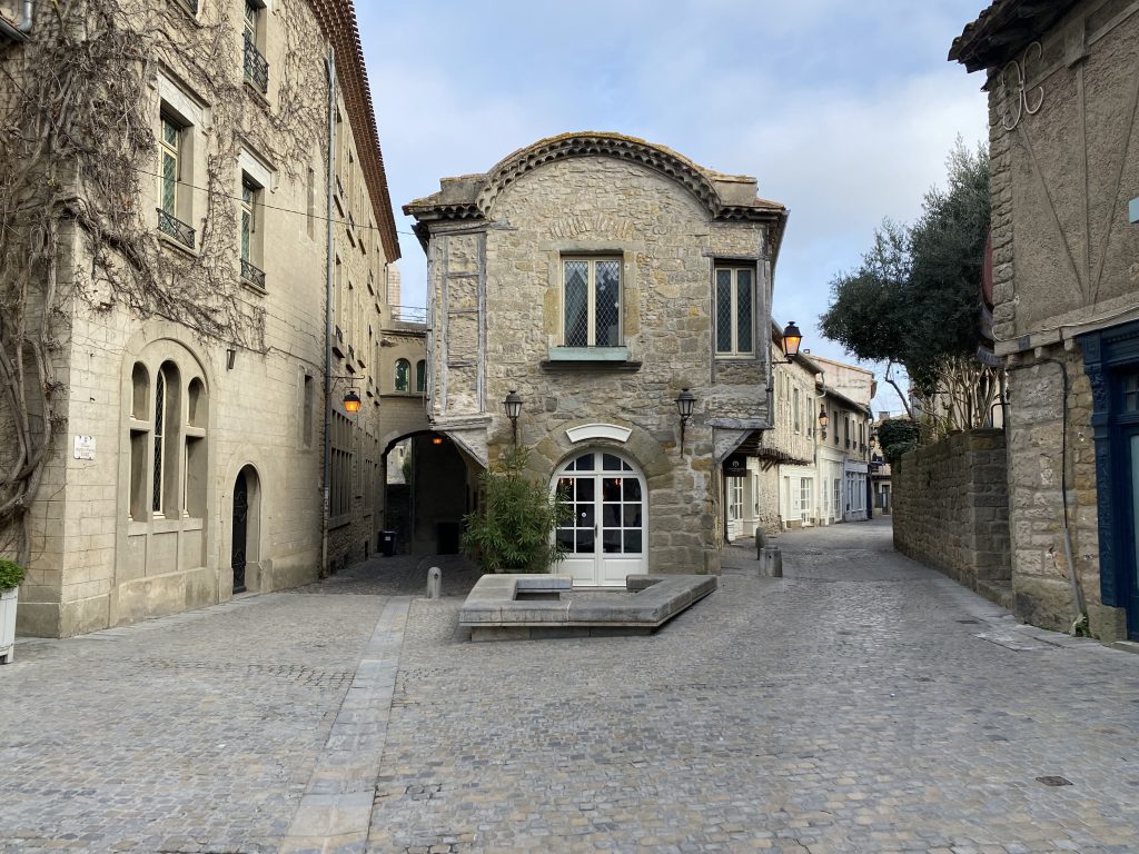 Charming stone architecture of Carcassonne, featuring rustic buildings and medieval structures with intricate details.